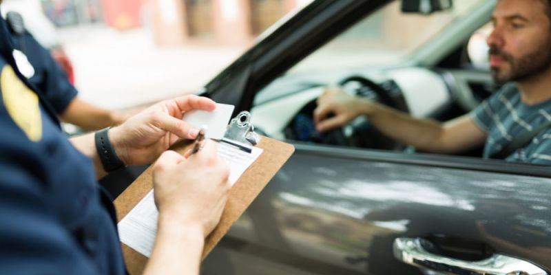 police officer giving a speeding ticket to a driver in virginia
