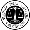 A circular black-and-white emblem features balanced scales centered within a double border, with the text "VIRGINIA TRIAL LAWYERS ASSOCIATION" and the founding year "1960" surrounding it.