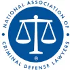 A blue and white logo features balanced scales within a circular frame, symbolizing justice, and the text "NATIONAL ASSOCIATION OF CRIMINAL DEFENSE LAWYERS".