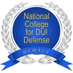 A circular emblem with a central blue starburst pattern, featuring text "National College for DUI Defense" surrounding the starburst, and a blue banner below with "NCDD" on it.