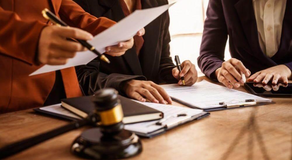 Group of people, possibly clients or legal