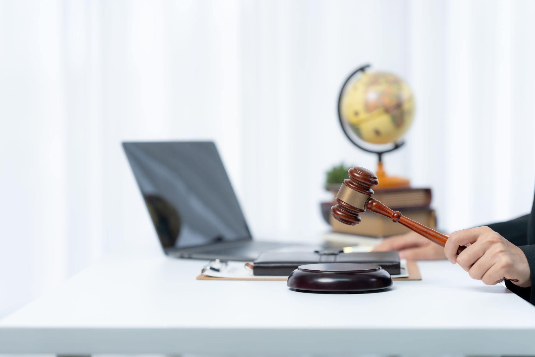 a person sitting at a desk with a judge