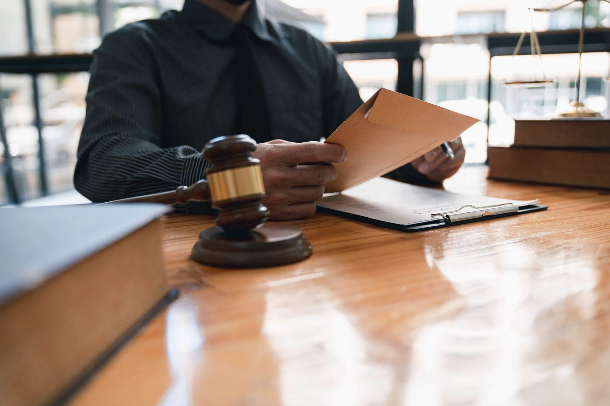 a person sitting at a table with a judge