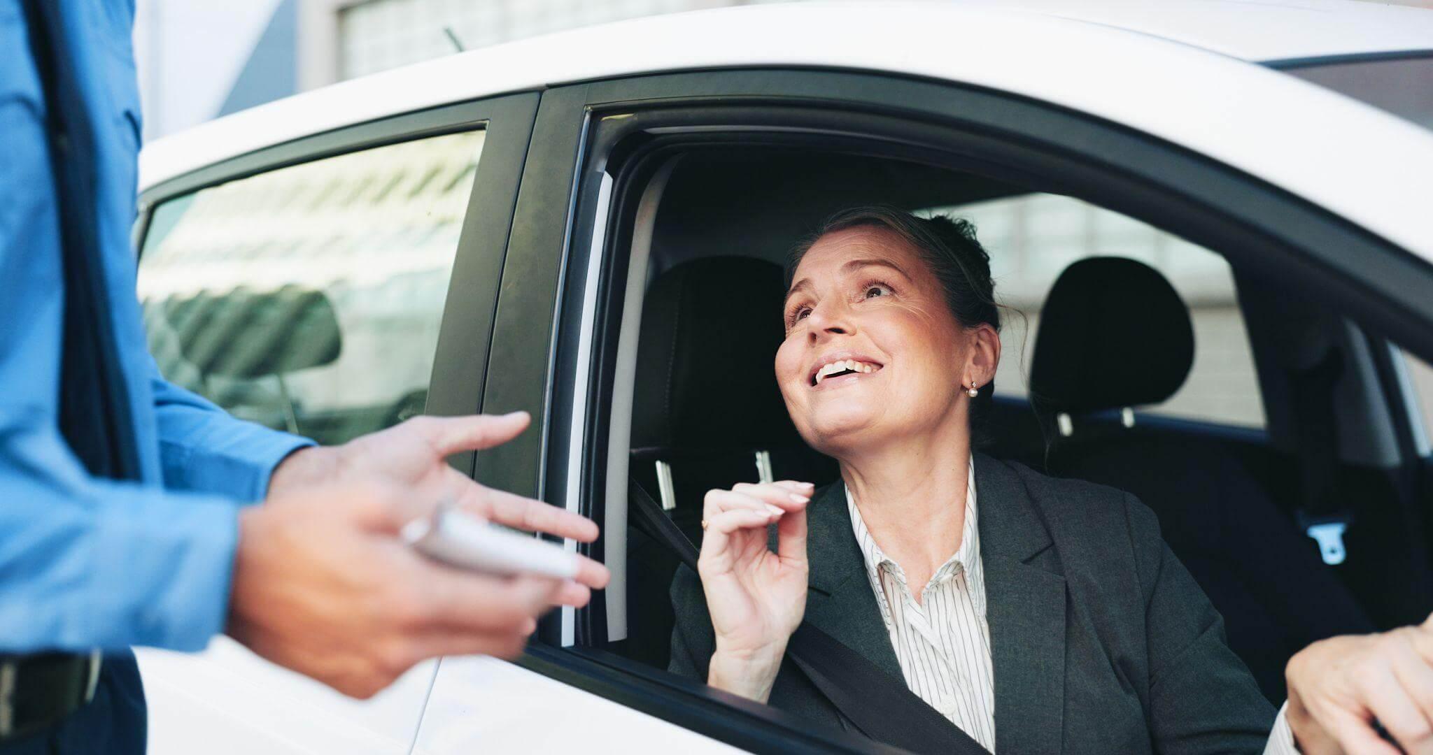 Woman in car talks to man at traffic stop