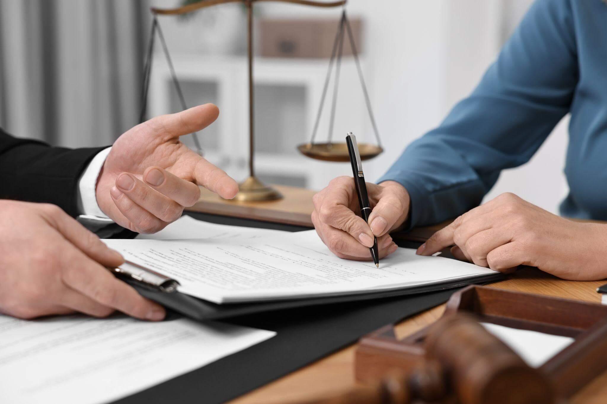 Couple reviewing documents at a table related to