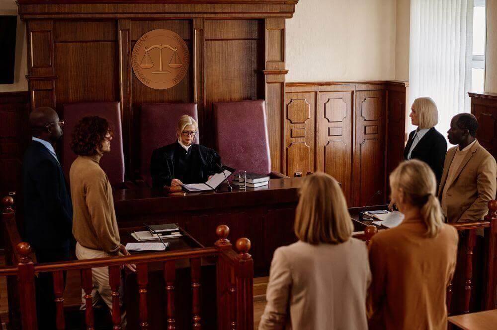 A group of people in a wooden courtroom
