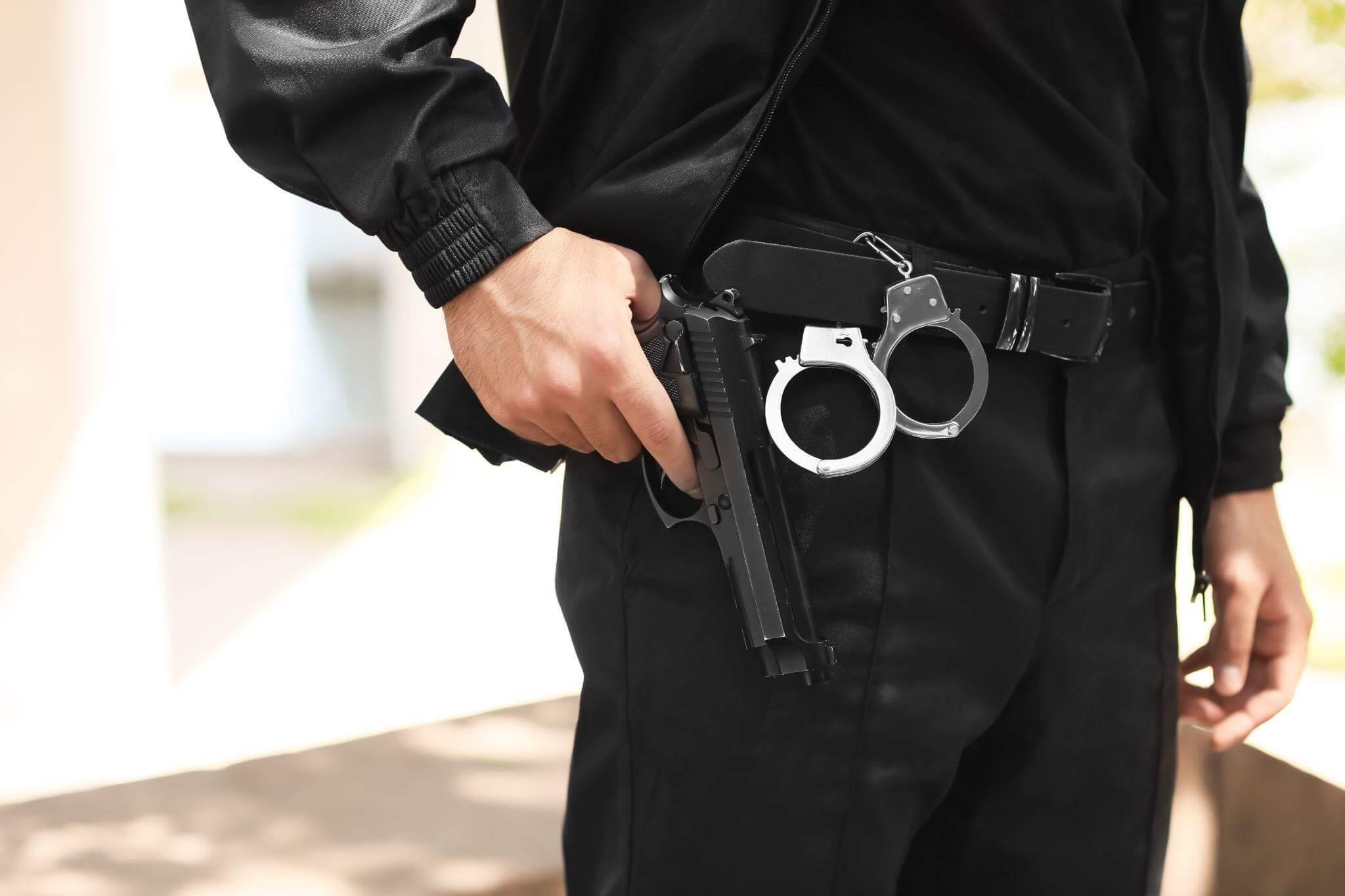 Man holding a gun, illustrating new Virginia gun laws