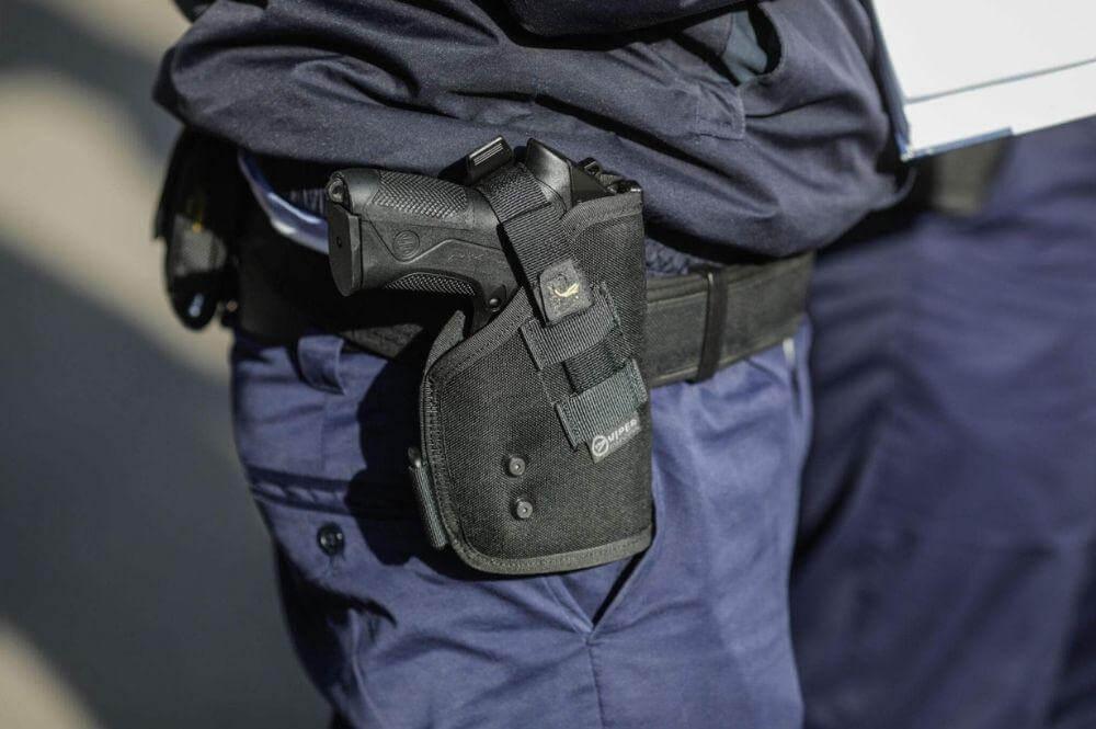 Police officer holding a gun, related to Virginia